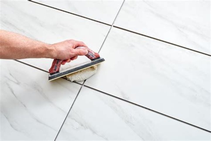 Can I use grout on vinyl tiles