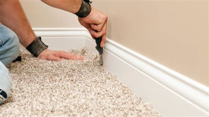How much space should I leave under baseboard for carpet