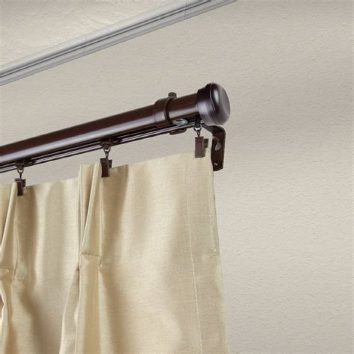 What are traverse curtain rods