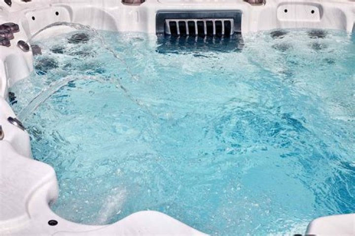 What causes scaling in hot tub