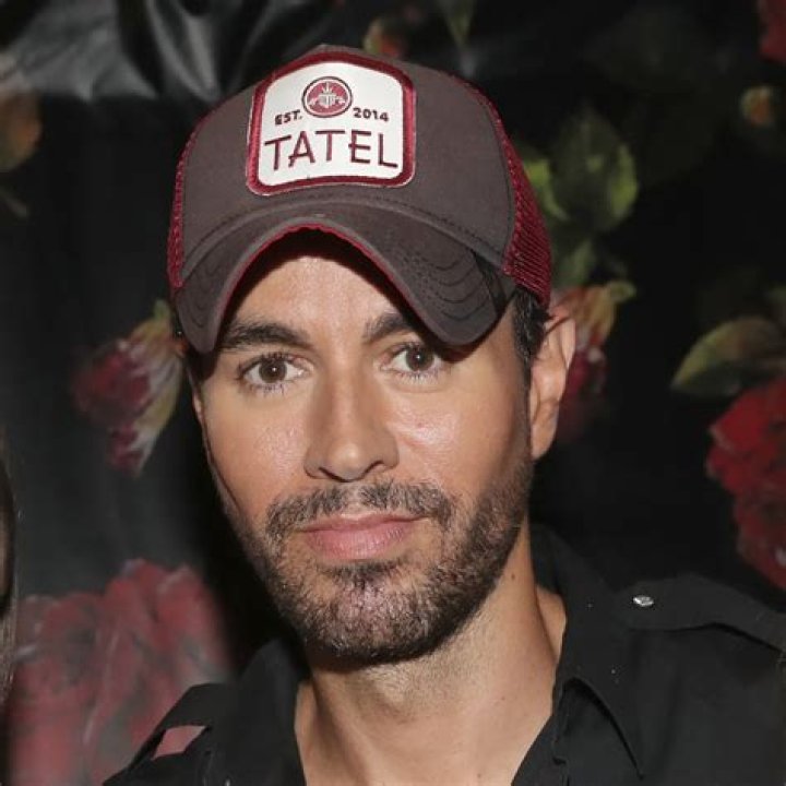 What does Enrique get a tattoo of