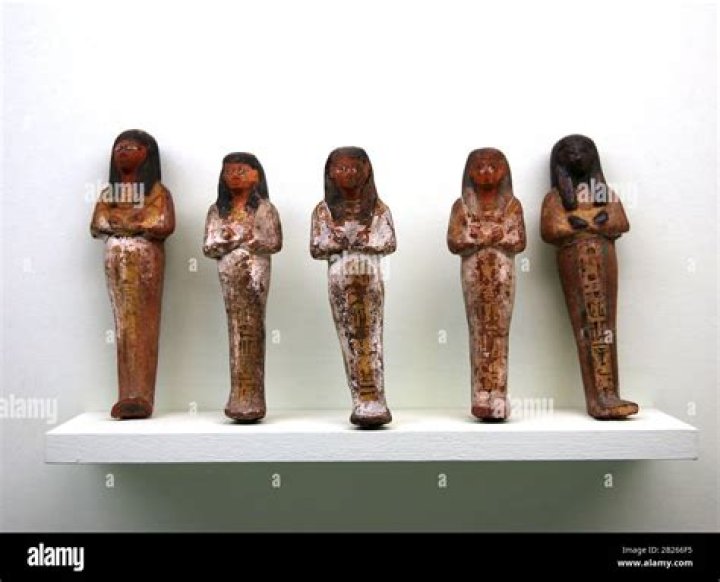 What is the name of the funerary figurine placed in tombs to serve as servants for the deceased in the afterlife