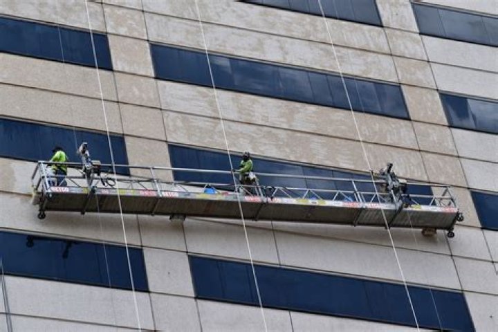 When working on a suspended scaffold 10 feet or higher above the working surface